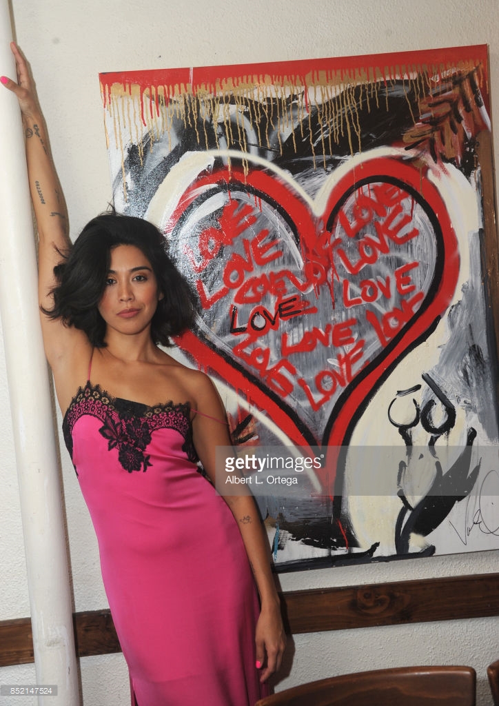 Actress Vanessa E. Garcia and Angie Sanchez attend the Vanessa E. Garcia's Art Show with partial proceeds going to House of Ruth based in East Los Angeles.